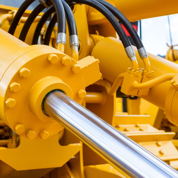 heavy machinery with hydraulic hoses